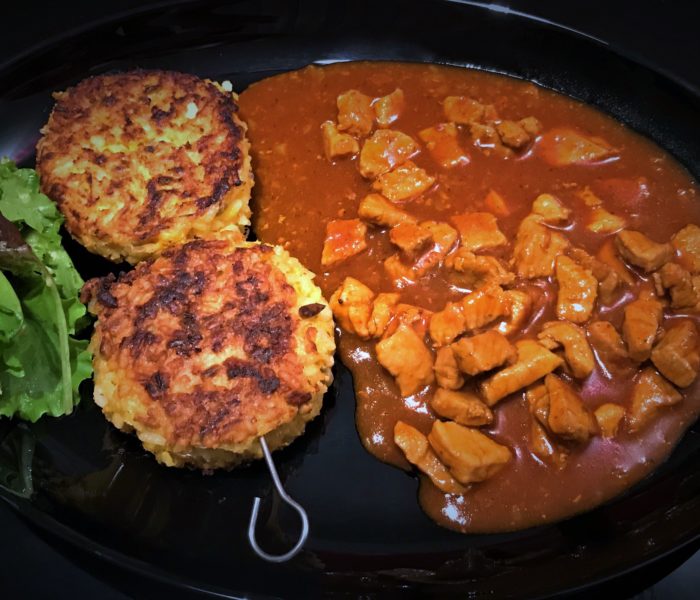 Risotto-Reis-Puffer mit Schweine-Gulasch